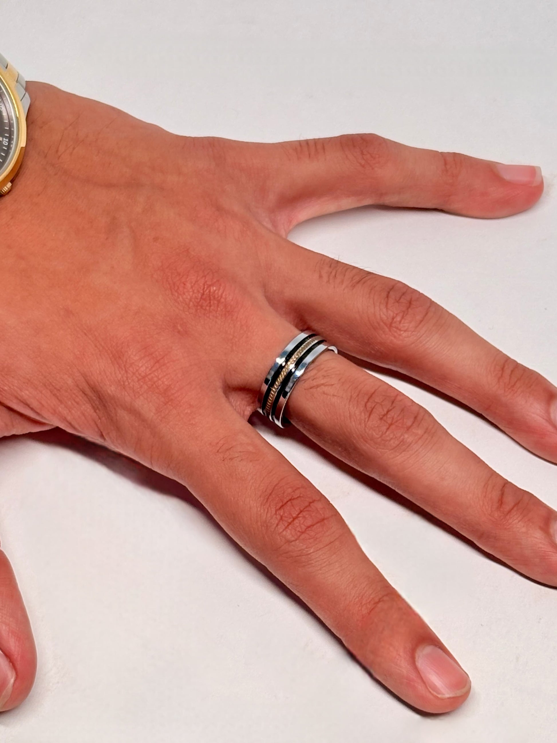 Ideal for showcasing a men's wedding band or fashion accessory, combining durability with sophisticated styling.